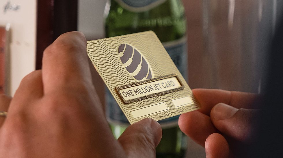 Person holding the one million jet card